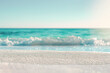 White sand beach and blured turquoise waves and sky on a background. Summertime seascape.