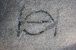 concrete wall texture with the Greek letter iota