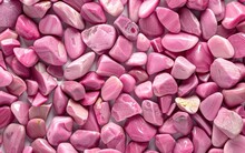A Captivating Collection Of Vibrant Pink Stones In Various Irregular Shapes And Sizes, Creating A Mesmerizing And Visually Striking Natural Texture.