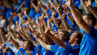 © XaMaps - Fans in blue jerseys jumping with joy after their team scores a goal.
