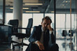 Sad businessman sitting in modern office