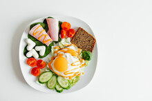 Fried Eggs For Breakfast With Vegetables, Ham, Mozarella On White Plate. Weight Loss Foods, Many Vitamins, Keto Menus Or Salads. Serving On The Table, White Background, Free Space For Text. No People