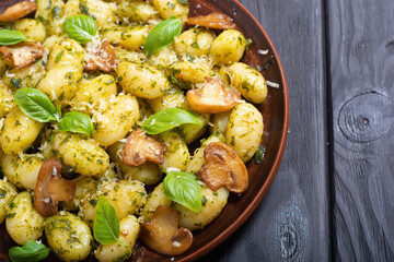 Canvas Print - Homemade potatoes gnocchi with basil , cheese and mushrooms