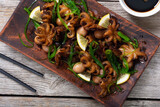 Fototapeta Panele - Baby octopus fried with lemon