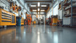 © HecoPhoto - Blurred view of a modern car repair service center with shelves toolboxes and equipment in the background