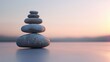 Balanced stone tower on a beige background with copy space.