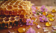 Honey in honeycombs with flowers on a wooden table