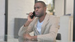 © stockbakers - Negotiating African American Man Talking on phone