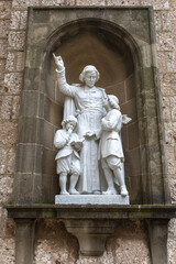 Wall Mural - Statue in Montserrat monastery, Catalonia, Spain : Saint Jean-Baptiste de la Salle with children