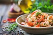 Succulent sautéed shrimps seasoned with herbs presented in a dark bowl, ready for a delicious seafood meal.