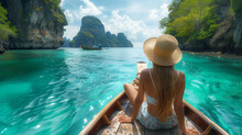 Young Woman Traveling On A Boat In The Ocean Of Thailand, Phi Phi Islands. Rear View, Girl With Hat Traveler And Adventurer On Vacation. Beach And Tropical Paradise.