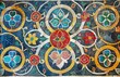 Antique circular floral mosaic with a rich historical ambiance. Vibrant tile patterns capturing the essence of traditional artisanship