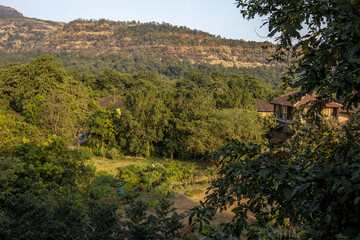 Wall Mural - Goverdan ecovillage at the foot of the Sahyadri mountain range, Maharashtra, India