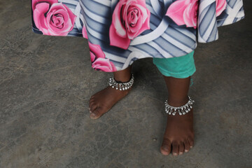 Wall Mural - Girl wearing ankle bracelets in Babra, Maharashtra, India