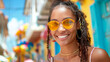Portrait of a beautiful african american woman wearing sunglasses and smiling outdoors