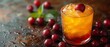   A tight shot of an ice tea glass filled to the brim, adorned with floating cherries Nearby, a cluster of cherries sits on the table