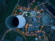 Aerial drone view on the Duisburg Walsum power station at night. A coal fired thermal power station, also creates heat for district heating and a 300m high chimney. Energy infrastructure in Germany.