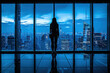 Woman stands by a window, looking out at city lights, in thought, a moment of introspection and inner exploration.