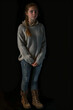 Contemplative Young Woman in Cozy Sweater and Boots - A Portrait Banner