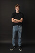 Confident Young Man in Black Tee and Jeans - Modern Casual Style Banner