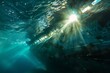 Underwater view of a ship moving with sunlight filtering through the ocean