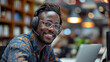 African man wearing headphones working with laptop, smiling and looking at camera, helpdesk, Gen AI