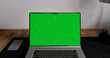 © Kaponia Aliaksei - Laptop place on room table, Green screen display, Close up monitor of notebook with mock up