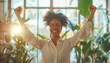 A joyful woman raising her fist in triumph, expressing happiness and success. Sunlight streaming through the window illuminates her cheerful smile. Positive energy and empowerment concept