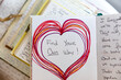 © Holly Clark/Stocksy - Hand drawn heart in journal with encouraging message
