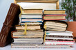 © Holly Clark/Stocksy - Close-up of stack of filled journals on white table