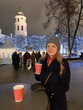 © Hernandez & Sorokina/Stocksy - Woman Enjoying Hot Drink In Vilnius At Christmas Time