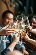 © Studio Firma/Stocksy - Group of people toasting