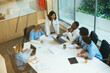 © BONNINSTUDIO/Stocksy - Healthcare workers having a meeting at hospital
