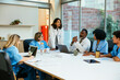 © BONNINSTUDIO/Stocksy - Healthcare workers having a meeting at hospital