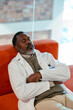 © BONNINSTUDIO/Stocksy - Doctor taking a break at hospital room