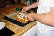 © Volya Tarasava/Stocksy - Anonymous man cooking vegetable pizza