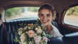 © Anna - Glowing newlywed bride in a vintage car with her bouquet, wearing a joyful smile.