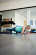 © Mauro Grigollo/Stocksy - Mature woman doing plank exercises at the gym