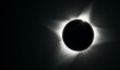 Total eclipse with bright solar corona on dark background