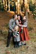© Lea Jones/Stocksy - portrait of family  in the fall