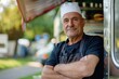 Portrait of mature male chef, food truck owner