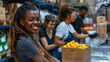 Happy black volunteer and her coworkers packing donations at food bank