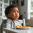 Cute dissatisfied black toddler with plate of delicious food looking away while sitting in kids chair at table in morning. Generative AI