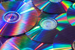 © Yaroslav Danylchenko/Stocksy - Iridescent light creating stripes on mirrored surface of CD discs