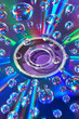 © Yaroslav Danylchenko/Stocksy - Gradient background formed by rainbow water drops CD disc