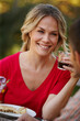 © peopleimages.com - Woman, happy or smiling with cup on picnic date with partner for love, romance and memories together. Person, drinking and eating healthy meal with boyfriend for conversation, bonding or relationship