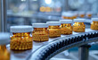 Automated pharmaceutical production line producing small white pills in bottle. The manufacturing process of medical pills on a conveyor belt. Pharmaceutical industry concept.