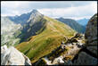 © Dima Sikorski/Stocksy - Beautiful mountain landscape with a trail on a sunny day