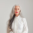 © TRINETTE + CHRIS - Studio portrait of beautiful mature woman with long grey hair