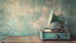 Antique turquoise gramophone with a turntable rests on a wooden table in front of a concrete wall. The retro image has a vintage feel thanks to the filter applied.